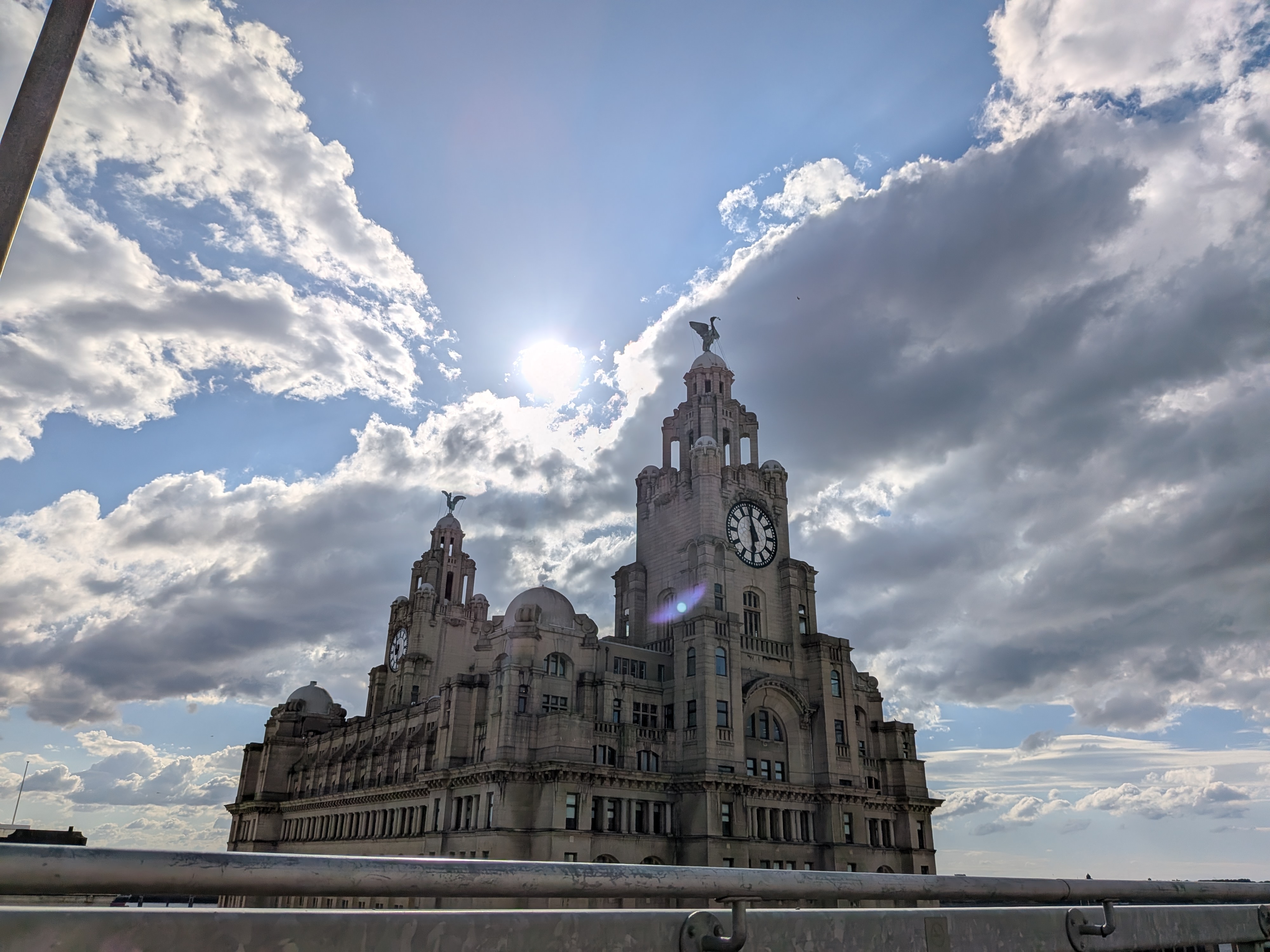 The Royal Liver Building against a bright cloudy sky