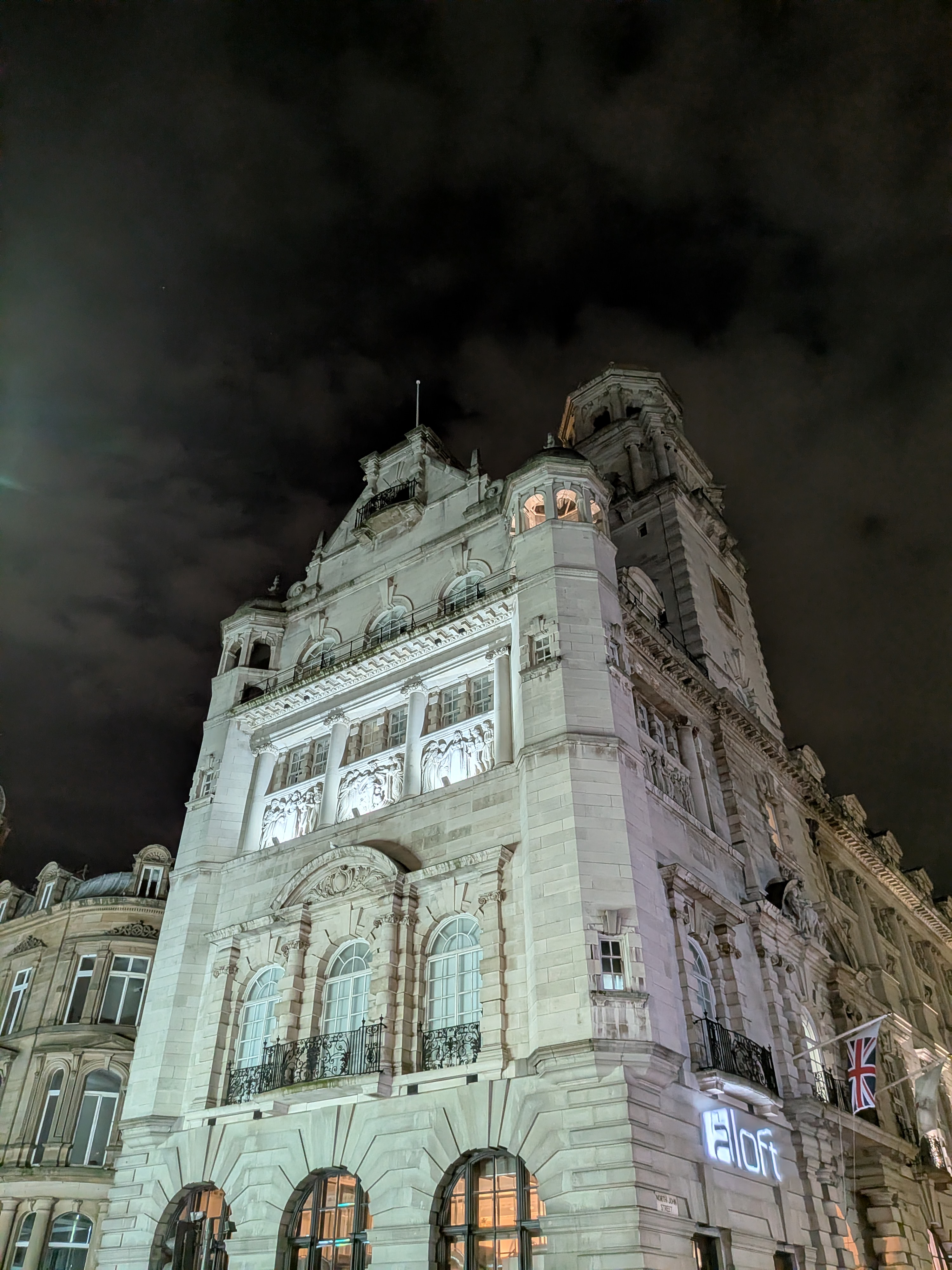 An ornate Liverpool building lit up at night